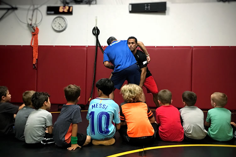 Adrian Garcia teaches a double-leg takedown.